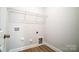 Laundry room with shelving and hookups for washer/dryer at 5308 Verona Rd # 75, Charlotte, NC 28213