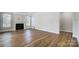 Spacious living room with hardwood floors and fireplace at 5308 Verona Rd # 75, Charlotte, NC 28213