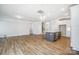 Light and airy living room with hardwood floors and kitchen island at 5308 Verona Rd # 75, Charlotte, NC 28213