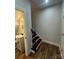 Hallway leading to a bathroom with stairs to the upper level at 1137 6Th St, Lancaster, SC 29720