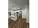 Bright kitchen features white cabinets, stainless appliances, and center island with pendant lighting at 1137 6Th St, Lancaster, SC 29720