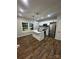 Bright kitchen features white cabinets, stainless appliances, and center island with pendant lighting at 1137 6Th St, Lancaster, SC 29720