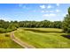 Aerial view of golf course with pond and cart path at 108 Fleming Dr, Statesville, NC 28677