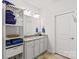 Double vanity bathroom with granite countertops and linen shelving at 108 Fleming Dr, Statesville, NC 28677