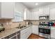 Well-equipped kitchen with granite countertops and stainless steel appliances at 108 Fleming Dr, Statesville, NC 28677