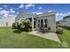 Outdoor dining area with a patio and view of the backyard and shade trees at 2105 Kennedy Dr, Indian Land, SC 29707