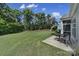 Lush green backyard with shade trees and patio, perfect for outdoor living at 2105 Kennedy Dr, Indian Land, SC 29707
