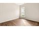 Bedroom with hardwood floors and a large window providing natural light at 2105 Kennedy Dr, Indian Land, SC 29707
