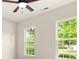 Bedroom with neutral walls and carpet, with two large windows and a ceiling fan at 2105 Kennedy Dr, Indian Land, SC 29707