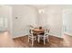 Cozy dining area with hardwood flooring, chandelier, and seating for four at 2105 Kennedy Dr, Indian Land, SC 29707