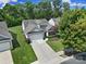 Charming home with well-manicured lawn, mature trees, and a two-car garage at 2105 Kennedy Dr, Indian Land, SC 29707