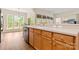 Kitchen featuring wood cabinets, stainless steel dishwasher, and white countertops at 2105 Kennedy Dr, Indian Land, SC 29707