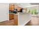 Well-lit kitchen featuring wood cabinets, backsplash, and stainless steel appliances at 2105 Kennedy Dr, Indian Land, SC 29707