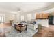 Bright living room with comfortable seating, hardwood floors, and an open kitchen view at 2105 Kennedy Dr, Indian Land, SC 29707