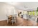 Open floor plan living space with dining area, ceiling fan, and large windows at 2105 Kennedy Dr, Indian Land, SC 29707