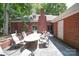 Outdoor patio featuring brick walls, brick chimney, and dining set at 3814 Watson Church Rd, Monroe, NC 28110