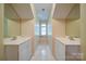 Hallway featuring dual sinks and built-in window seat at 3814 Watson Church Rd, Monroe, NC 28110