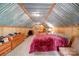 Cozy bedroom with a wood-paneled walls, carpet flooring, and a rustic charm in the attic at 3814 Watson Church Rd, Monroe, NC 28110