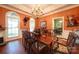 Elegant dining room with decorative chandelier and large windows for natural light at 3814 Watson Church Rd, Monroe, NC 28110