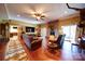 Spacious living room features hardwood floors, stone fireplace, and a sliding glass door at 3814 Watson Church Rd, Monroe, NC 28110