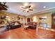 Spacious living room with hardwood floors, ceiling fan, and classic decor at 3814 Watson Church Rd, Monroe, NC 28110