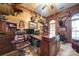 Spacious office featuring wood paneling, large desk, and hunting decor for a rustic yet professional feel at 3814 Watson Church Rd, Monroe, NC 28110