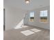 Bedroom with neutral carpet and two large windows at 633 Amberjack Pl, York, SC 29745