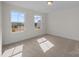 Bedroom with neutral carpet and two windows at 633 Amberjack Pl, York, SC 29745