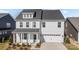 Exterior shot of a two-story house with a blue front door and attached garage at 633 Amberjack Pl, York, SC 29745