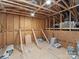 Unfinished attic space with exposed wooden beams and plywood walls at 4031 Pritchard Pl, Fort Mill, SC 29715