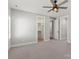 Bedroom with neutral carpet, ceiling fan, and access to closet and bathroom at 4031 Pritchard Pl, Fort Mill, SC 29715