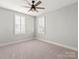 Spacious bedroom with neutral carpet and plantation shutters at 4031 Pritchard Pl, Fort Mill, SC 29715