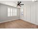 Bright bedroom with hardwood floors, white trim, and natural light at 4031 Pritchard Pl, Fort Mill, SC 29715