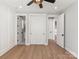 Bedroom showcasing hardwood floors and multiple closets and doorways at 4031 Pritchard Pl, Fort Mill, SC 29715