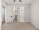 Bedroom with neutral carpet and a bathroom with a shower and walk in closet at 4031 Pritchard Pl, Fort Mill, SC 29715