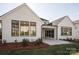 Rear exterior of a modern home with dark trim and a covered patio at 4031 Pritchard Pl, Fort Mill, SC 29715