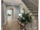 Entryway view showcasing hardwood floors, staircase with metal railings at 4031 Pritchard Pl, Fort Mill, SC 29715