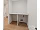 Bright laundry room with a large countertop and wood flooring at 4031 Pritchard Pl, Fort Mill, SC 29715