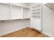 Spacious walk-in closet with custom white shelving and hardwood floors at 4031 Pritchard Pl, Fort Mill, SC 29715