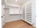 Large walk-in closet featuring custom shelving and hardwood floors at 4031 Pritchard Pl, Fort Mill, SC 29715