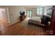 Primary suite boasts hardwood floors, a king-size bed, and access to a balcony at 224 N Poplar St # 15, Charlotte, NC 28202