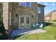 Brick patio with French doors and small table set at 3012 Wheatfield Dr, Waxhaw, NC 28173