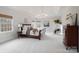 Main bedroom with plush carpet, large windows and a dresser at 3012 Wheatfield Dr, Waxhaw, NC 28173