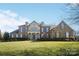 Two-story home with brick facade and landscaping at 3012 Wheatfield Dr, Waxhaw, NC 28173