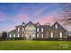 Brick front two-story home with a large front yard at 3012 Wheatfield Dr, Waxhaw, NC 28173