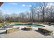Relaxing backyard fire pit with lounge chairs at 3012 Wheatfield Dr, Waxhaw, NC 28173