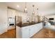 Modern kitchen with white cabinets, granite counters and island at 3012 Wheatfield Dr, Waxhaw, NC 28173