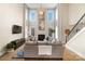 Two story living room with a fireplace and large windows at 3012 Wheatfield Dr, Waxhaw, NC 28173