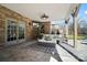 Covered patio with comfortable seating and outdoor TV at 3012 Wheatfield Dr, Waxhaw, NC 28173