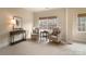 Bright sitting room with two armchairs and a console table, offering a peaceful space at 3012 Wheatfield Dr, Waxhaw, NC 28173
